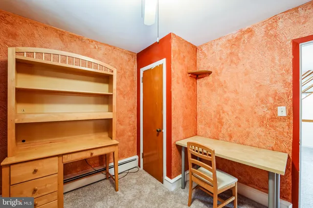 a view of room with window and furniture