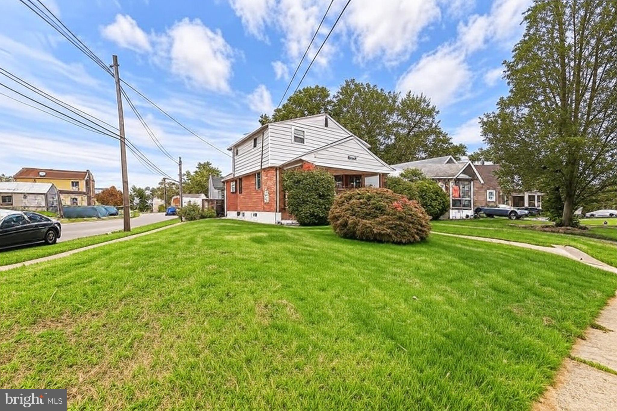 200 East Roland Road Brookhaven, PA 19015 - Photo 2 of 47 a front view of a house with garden