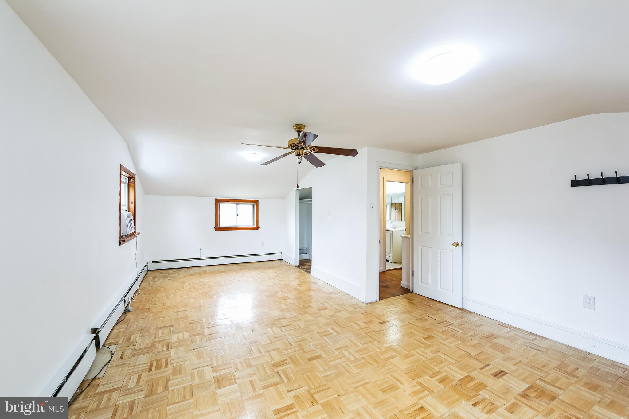200 East Roland Road Brookhaven, PA 19015 - Photo 22 of 47 a view of a big room with windows and chandelier fan