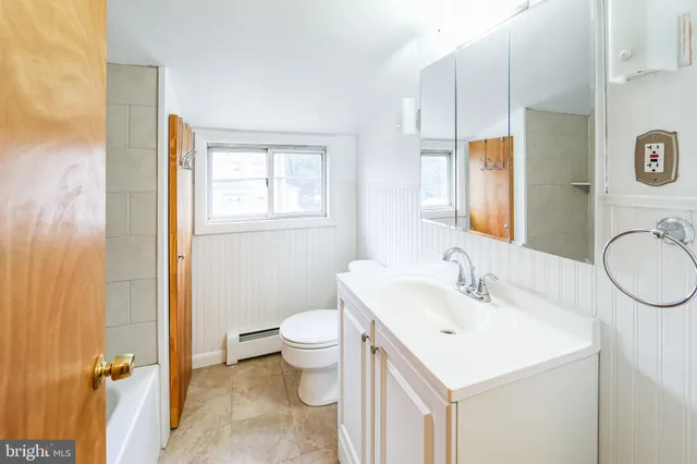 a white bath tub sitting in a bathroom