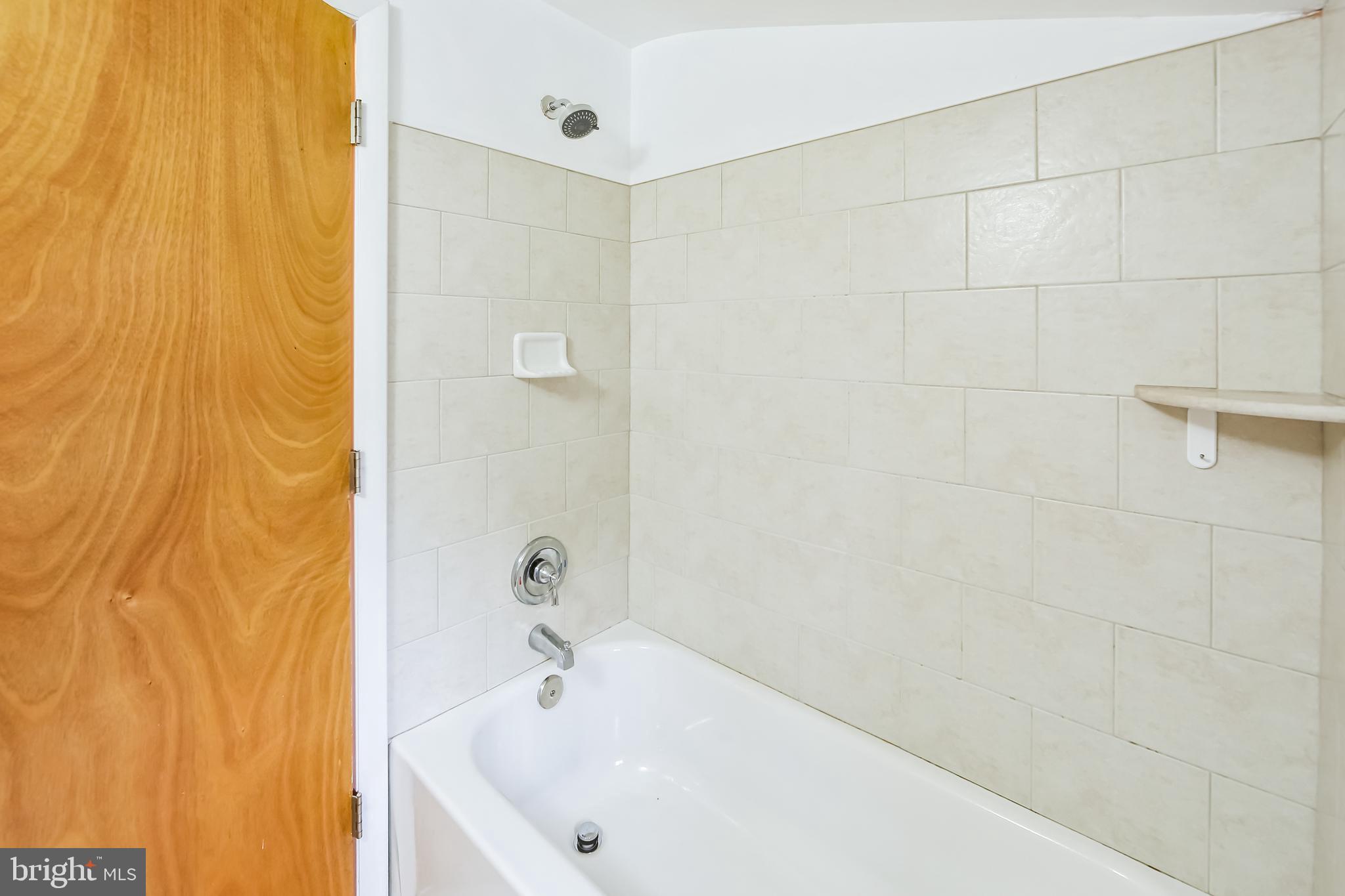 200 East Roland Road Brookhaven, PA 19015 - Photo 30 of 47 a white bath tub sitting in a bathroom