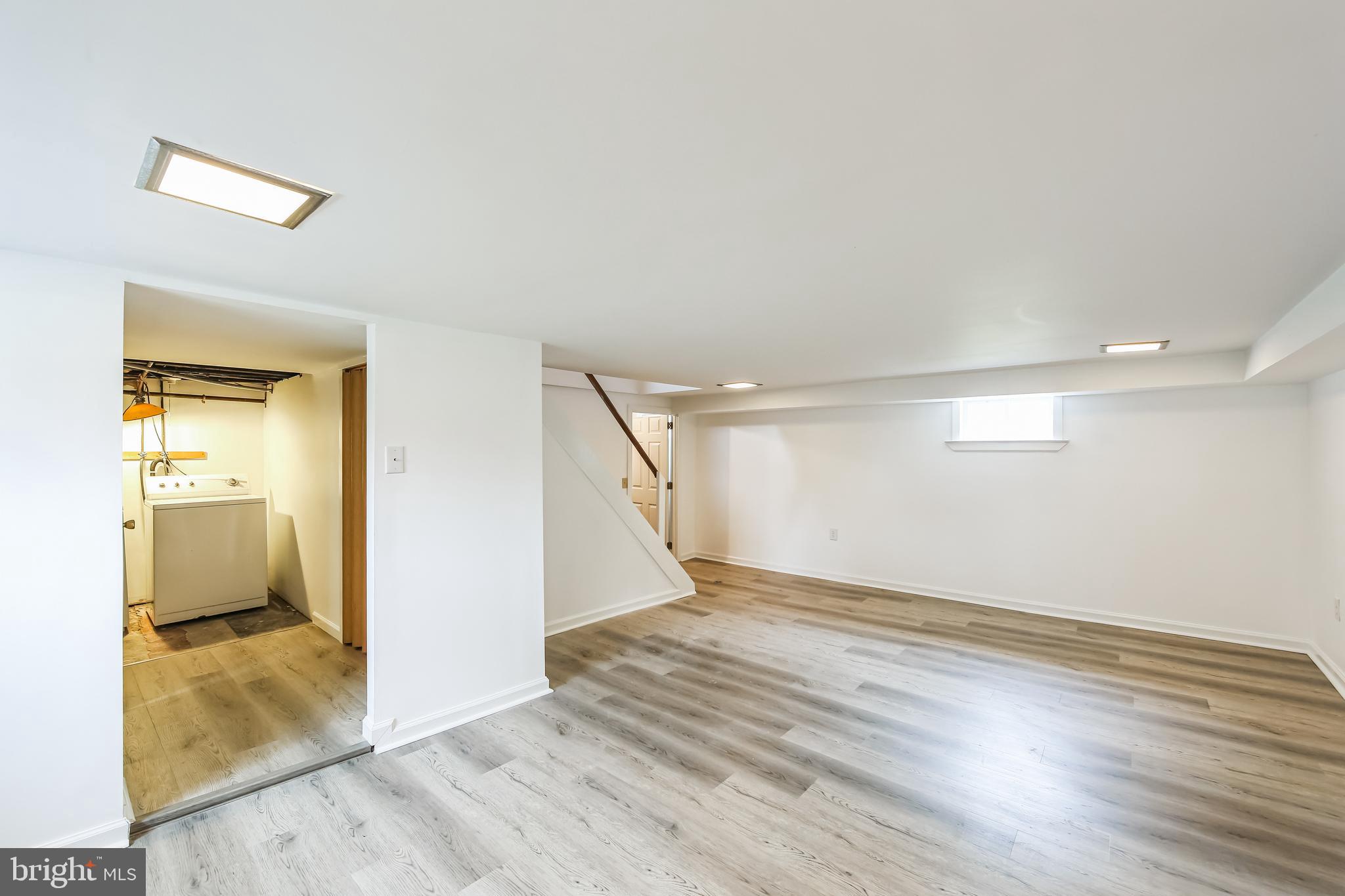 200 East Roland Road Brookhaven, PA 19015 - Photo 32 of 47 wooden floor in a room and a bathroom