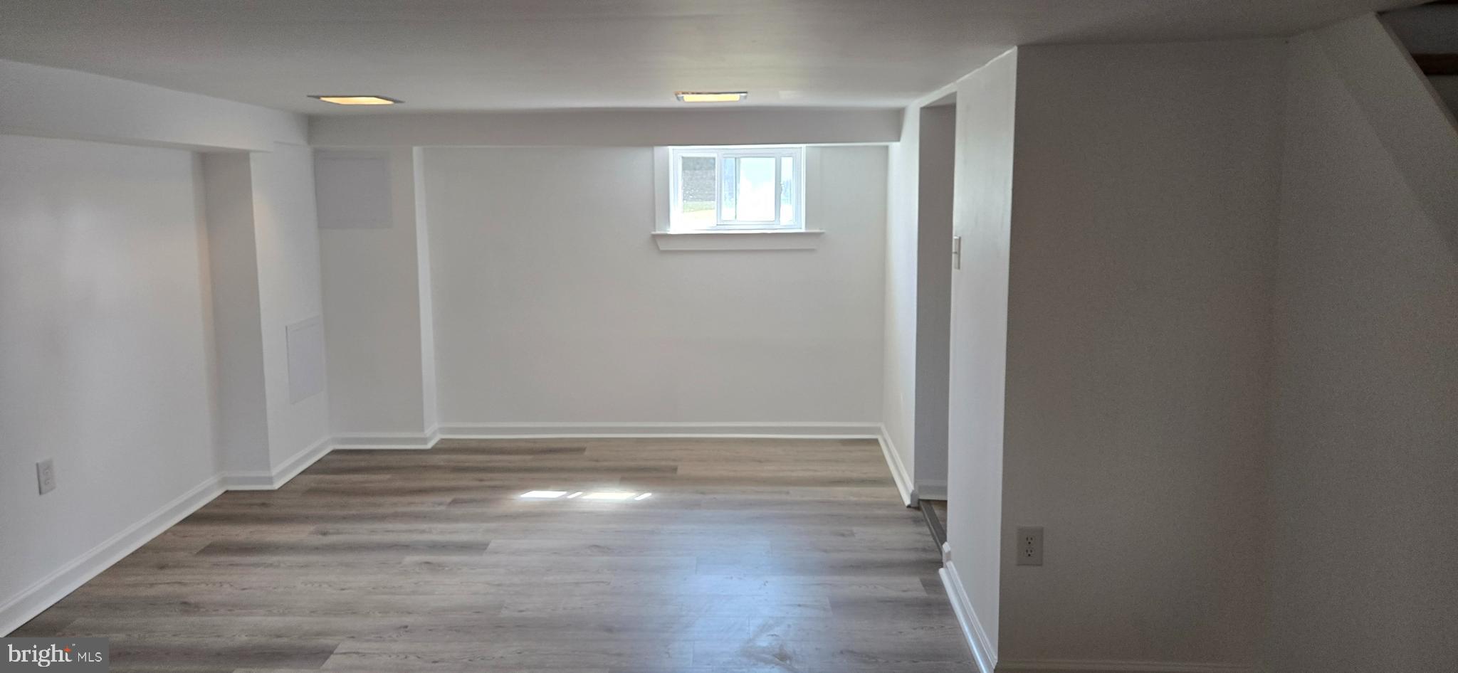 200 East Roland Road Brookhaven, PA 19015 - Photo 37 of 47 an empty room with wooden floor and windows