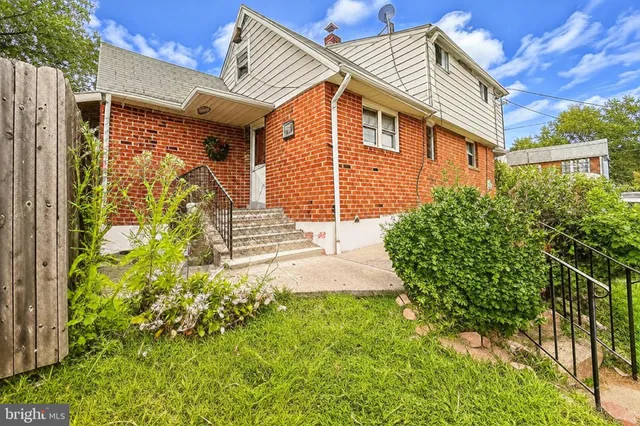 a view of a backyard with swimming pool
