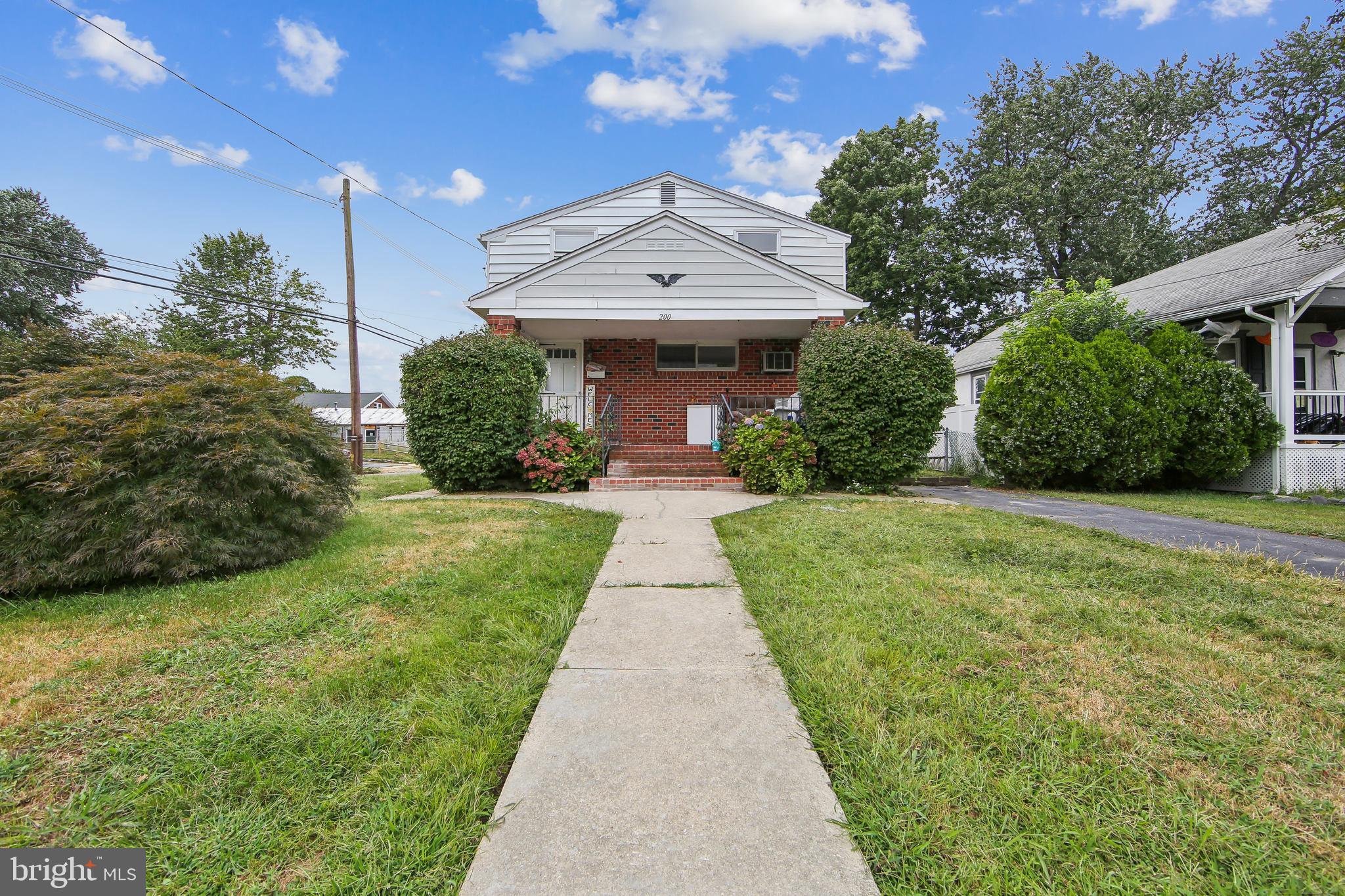 200 East Roland Road Brookhaven, PA 19015 - Photo 4 of 47 a view of house with garden