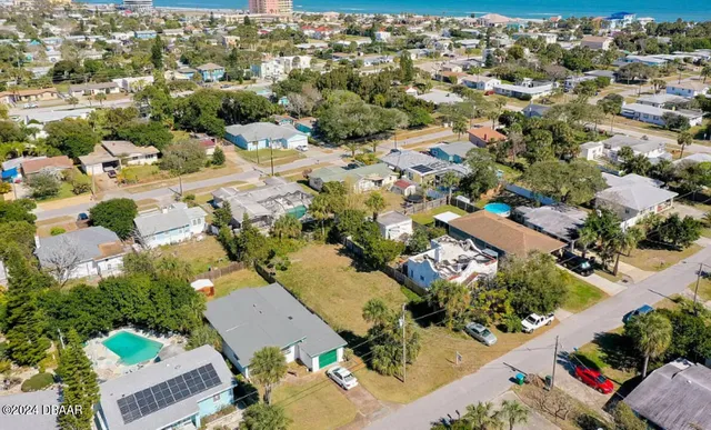 an aerial view of a city with lots of residential buildings
