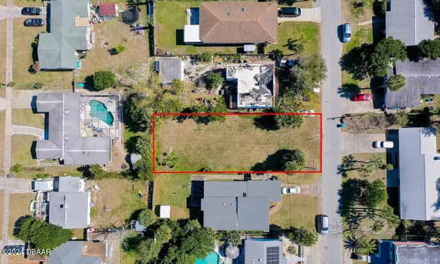 an aerial view of multiple houses with outdoor space