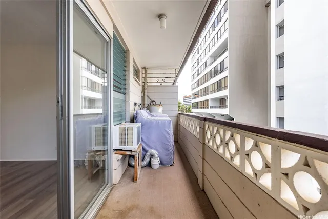 a view of an chairs and with furniture in a balcony