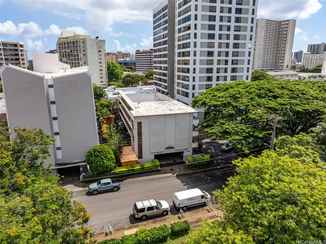 aerial view of a house with garden and plants