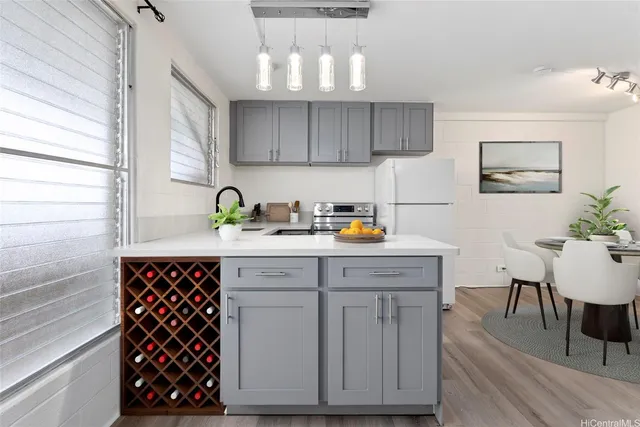 a kitchen with a sink cabinets and window