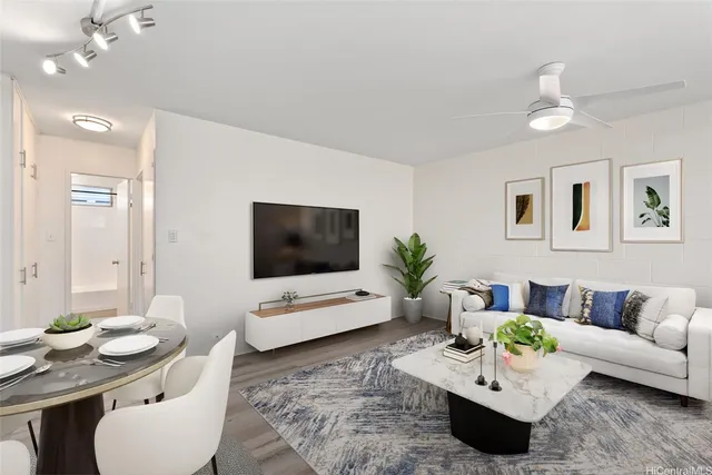 a living room with furniture and a flat screen tv