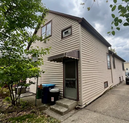 a view of a house with a potted plant