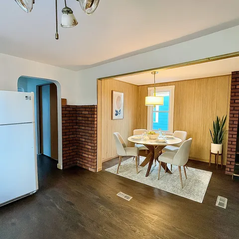 a dining room with furniture and window