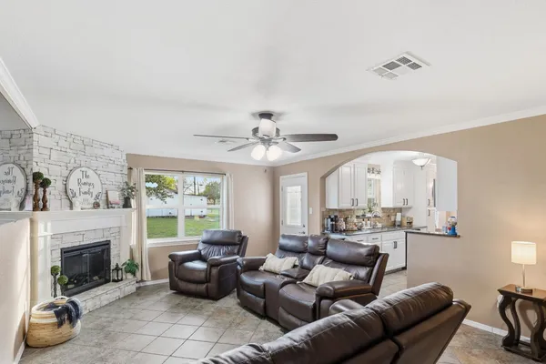 a living room with furniture and a fireplace