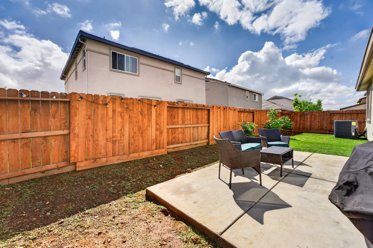 11986 Granzella Way Rancho Cordova, CA 95742 - Photo 27 of 55 Backyard Patio poured, artificial turf installed on the south portion of the yard along with drains waiting for you to create your masterpiece.