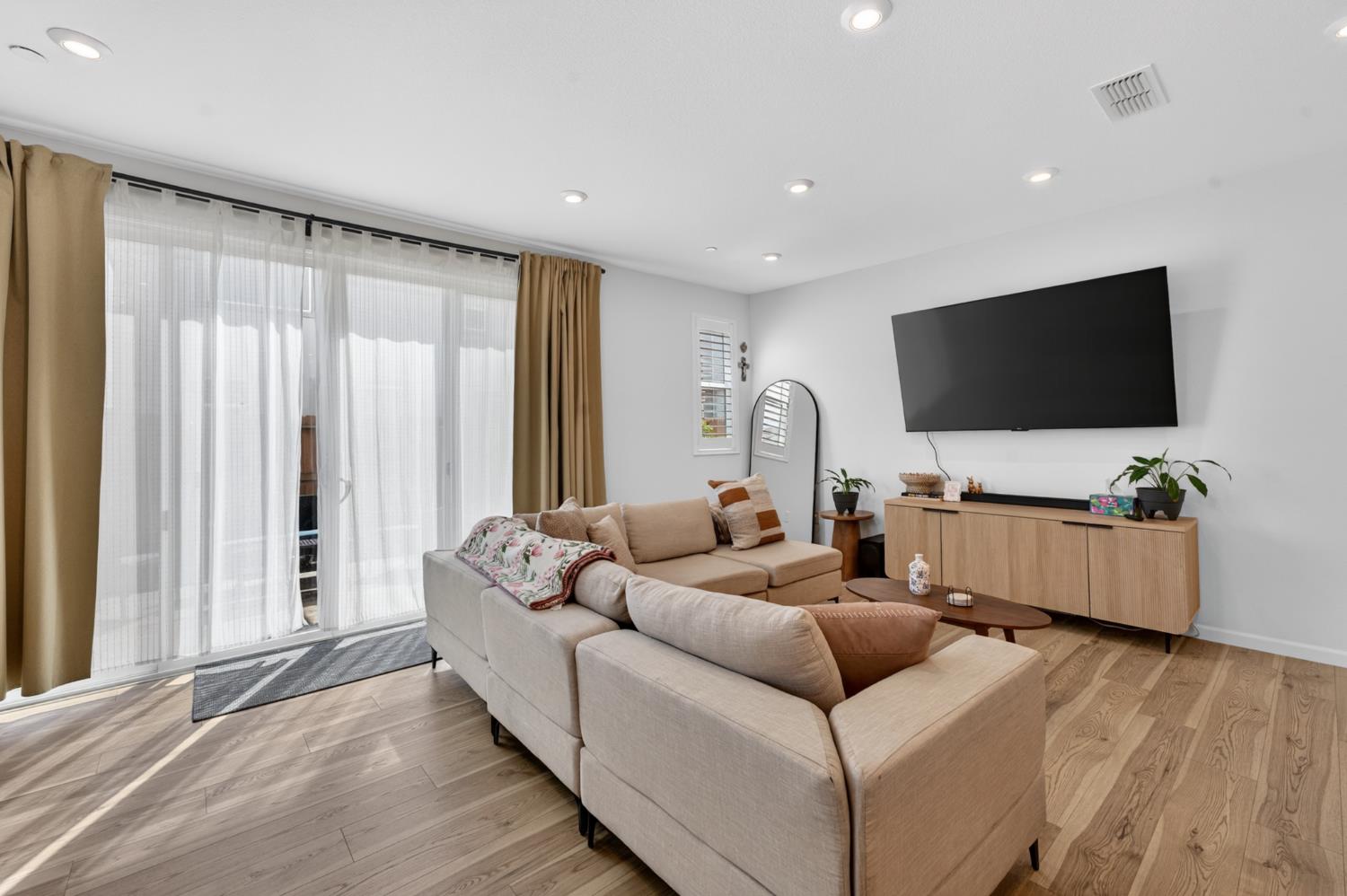 11986 Granzella Way Rancho Cordova, CA 95742 - Photo 3 of 55 Living Room Open to the Kitchen and Dining area with Sliders to the Backyard to let the Natural Light in and the Cool Breeze