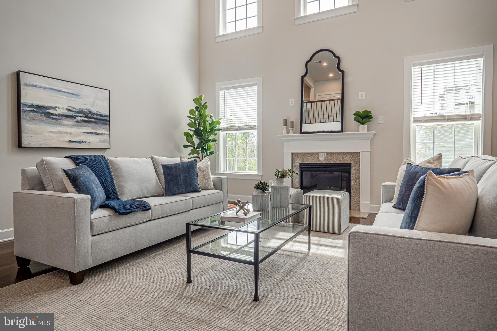 731 Stonecliffe Road Malvern, PA 19355 - Photo 13 of 81 a living room with furniture a large window and a fireplace