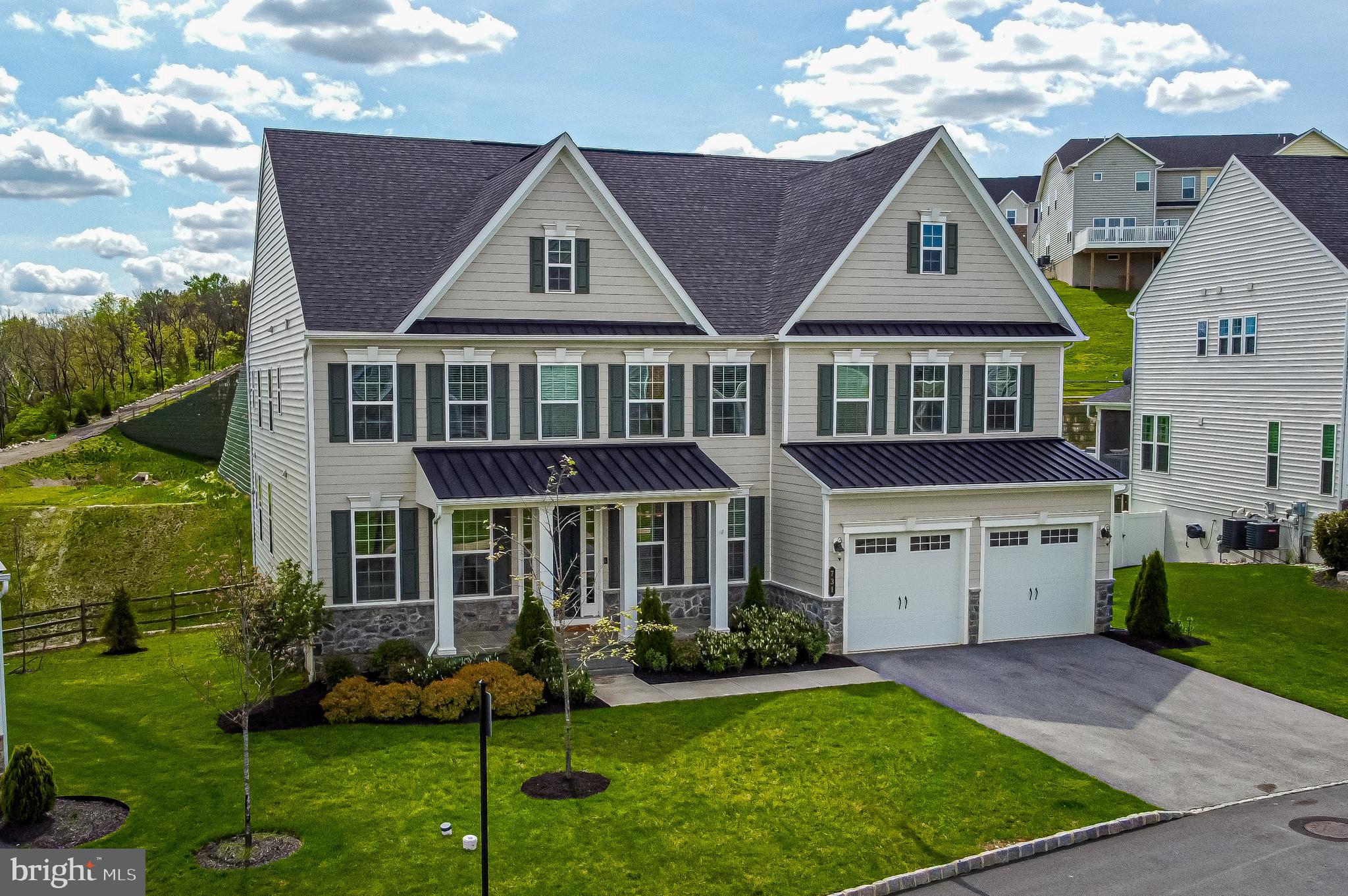 731 Stonecliffe Road Malvern, PA 19355 - Photo 2 of 81 a front view of a house with a yard