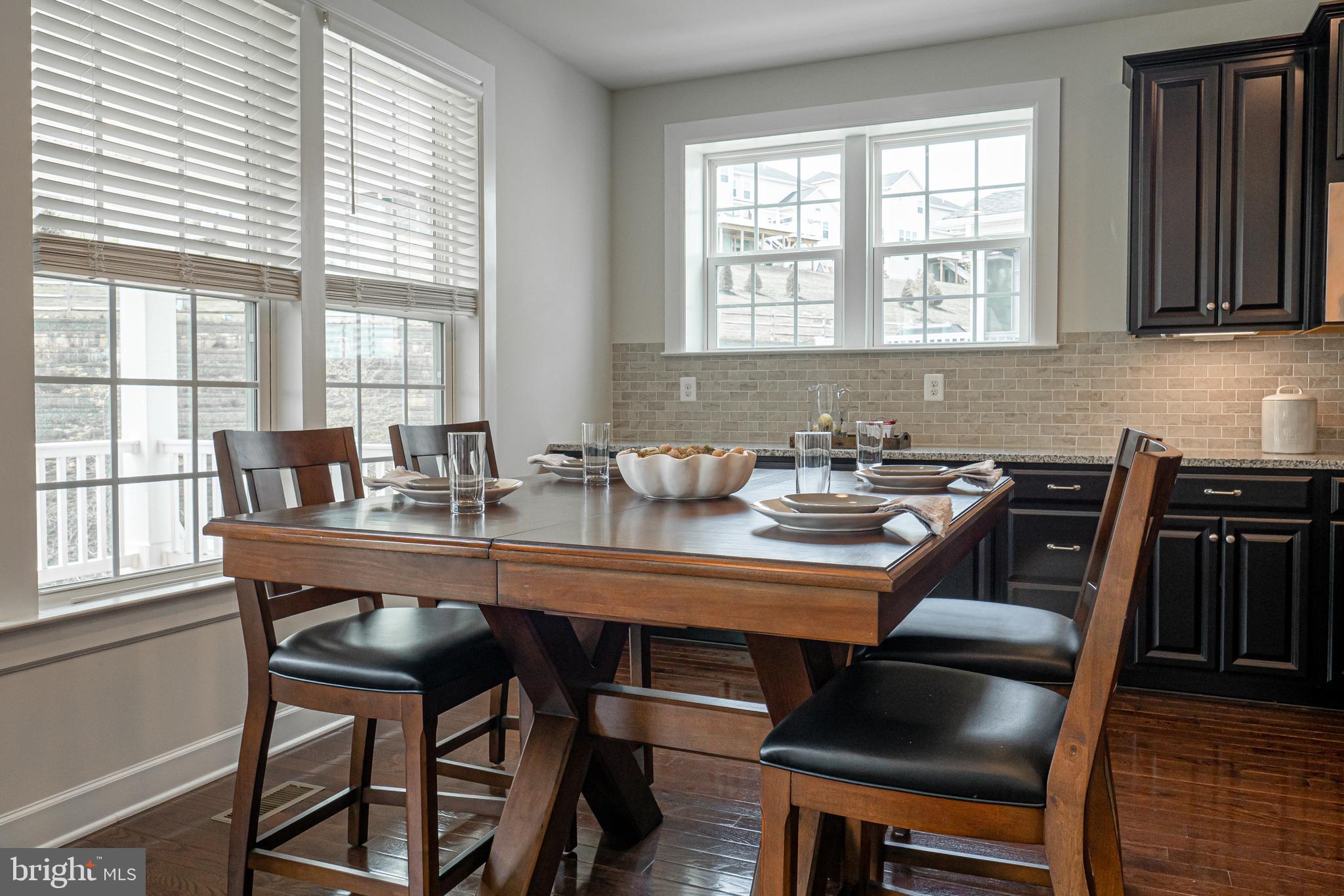 731 Stonecliffe Road Malvern, PA 19355 - Photo 24 of 81 a view of a dining room with furniture window and wooden floor