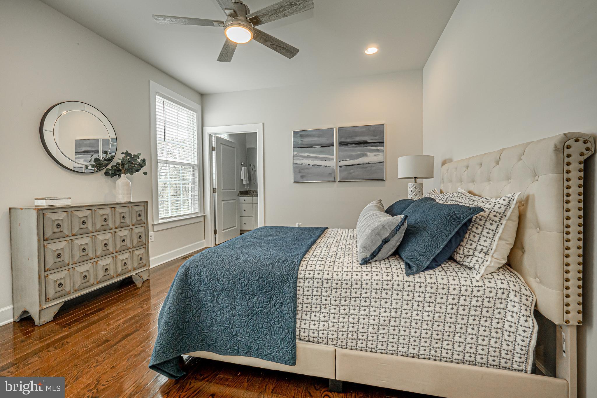 731 Stonecliffe Road Malvern, PA 19355 - Photo 39 of 81 a bedroom with a large bed and a chandelier