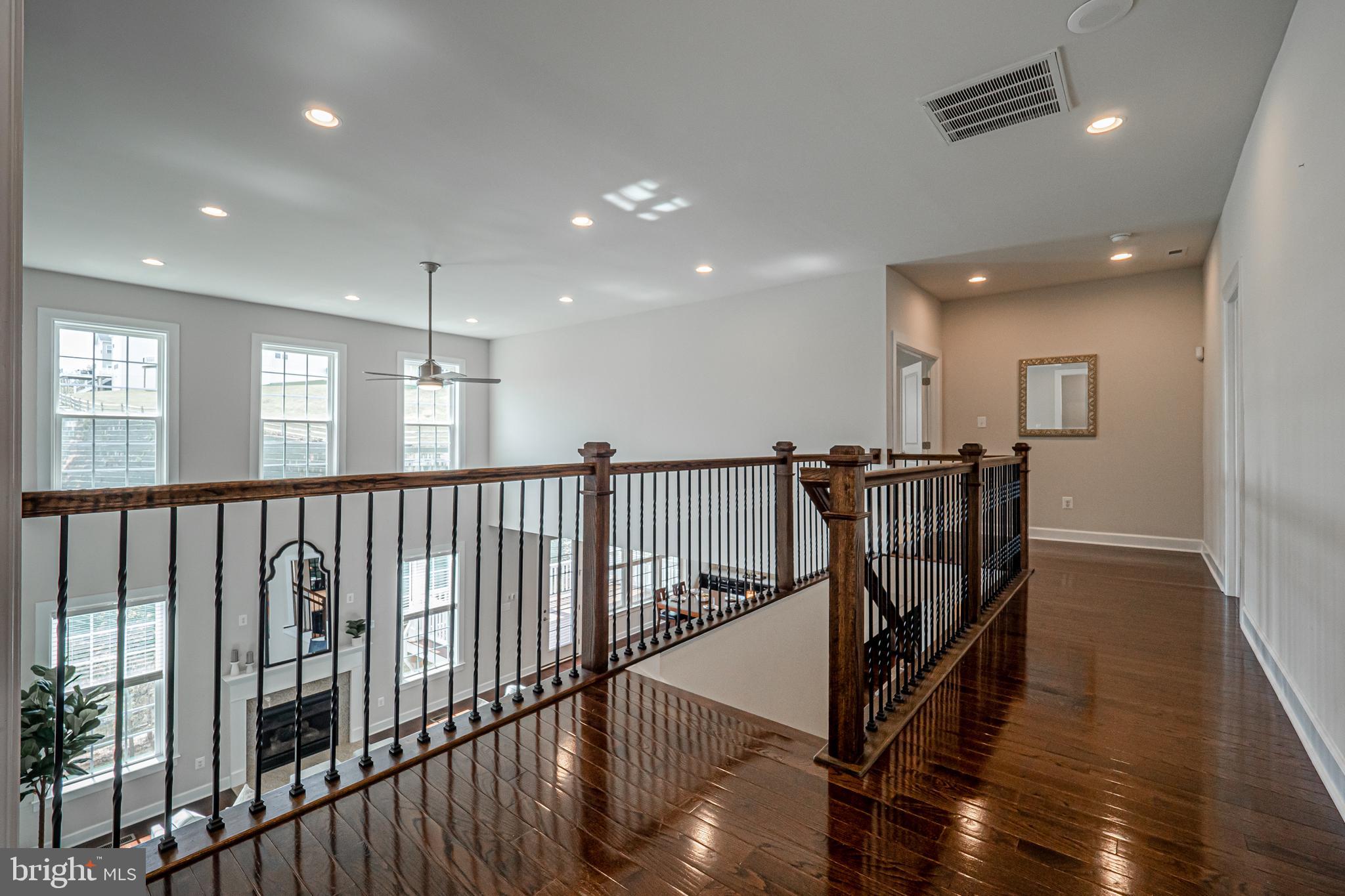 731 Stonecliffe Road Malvern, PA 19355 - Photo 41 of 81 a view of a hallway with wooden floor and windows
