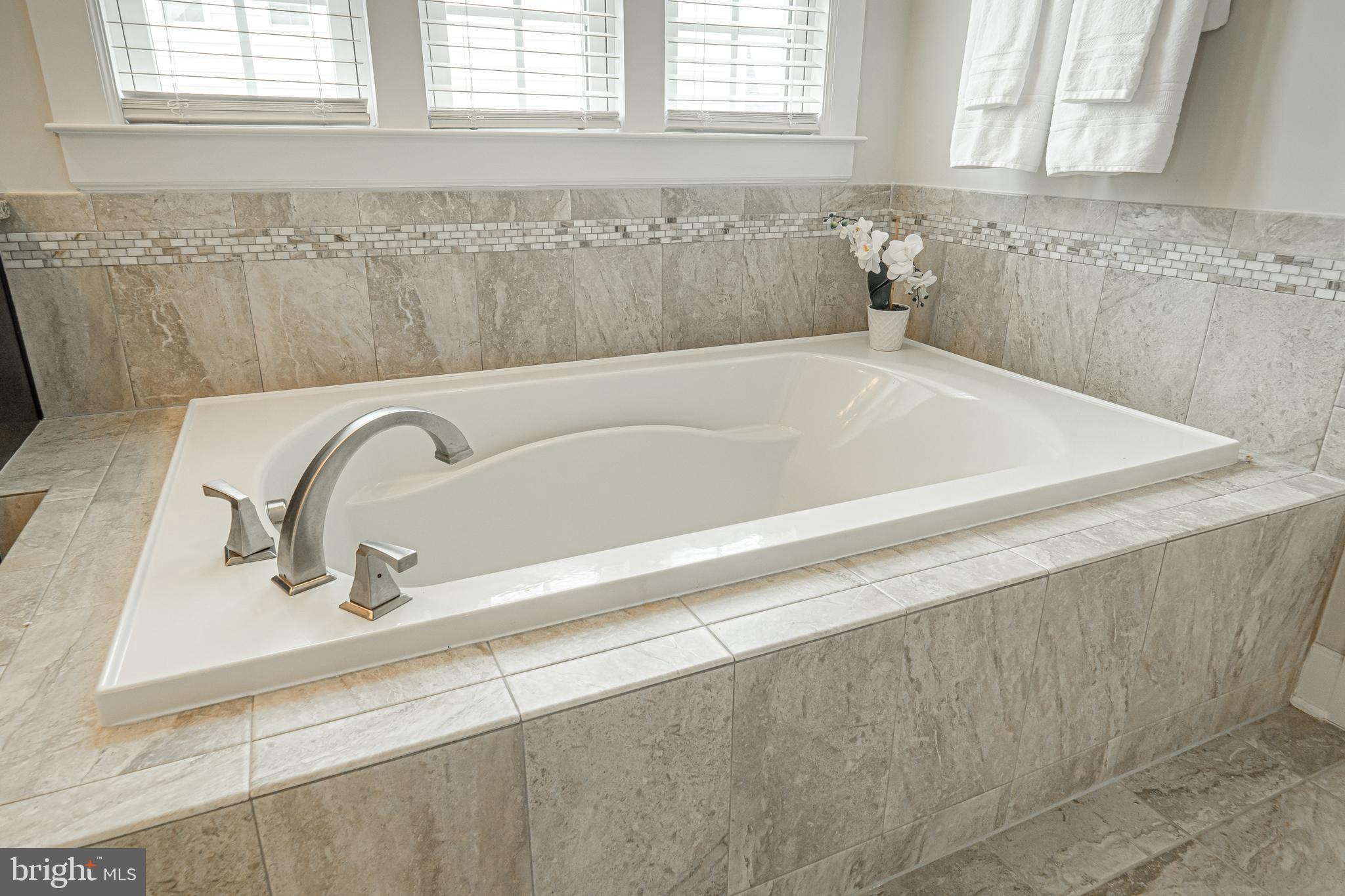 731 Stonecliffe Road Malvern, PA 19355 - Photo 52 of 81 a bath tub sitting next to a window