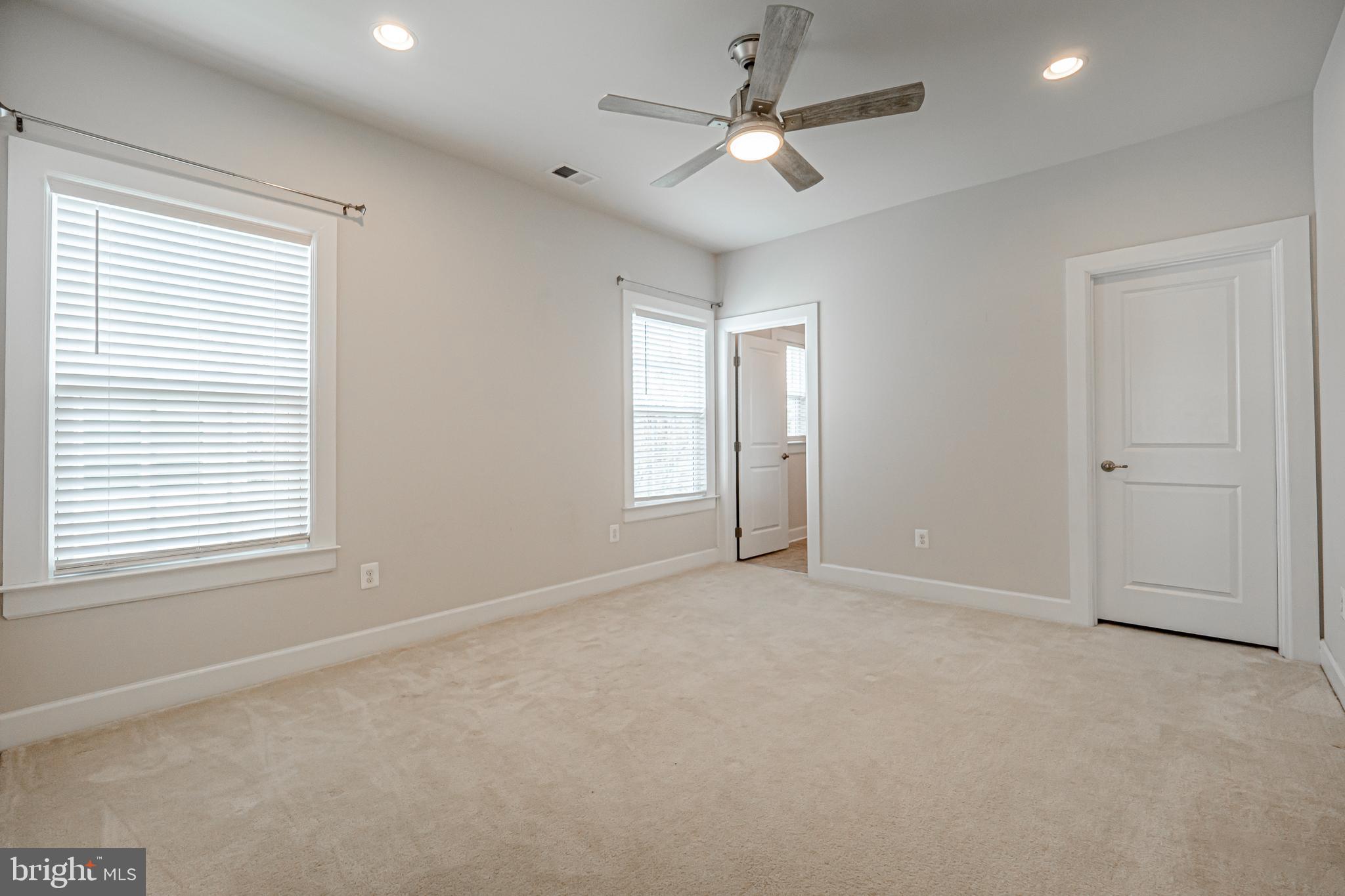 731 Stonecliffe Road Malvern, PA 19355 - Photo 60 of 81 an empty room with windows and fan
