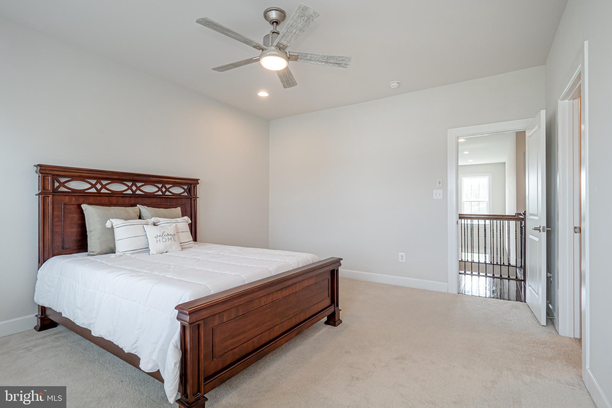 731 Stonecliffe Road Malvern, PA 19355 - Photo 67 of 81 a bedroom with a bed and a chandelier