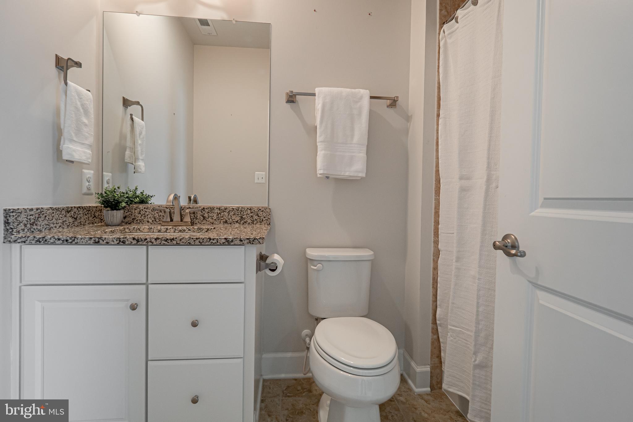 731 Stonecliffe Road Malvern, PA 19355 - Photo 68 of 81 a bathroom with a granite countertop sink and a mirror