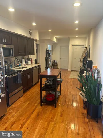 a kitchen with a table and chairs in it
