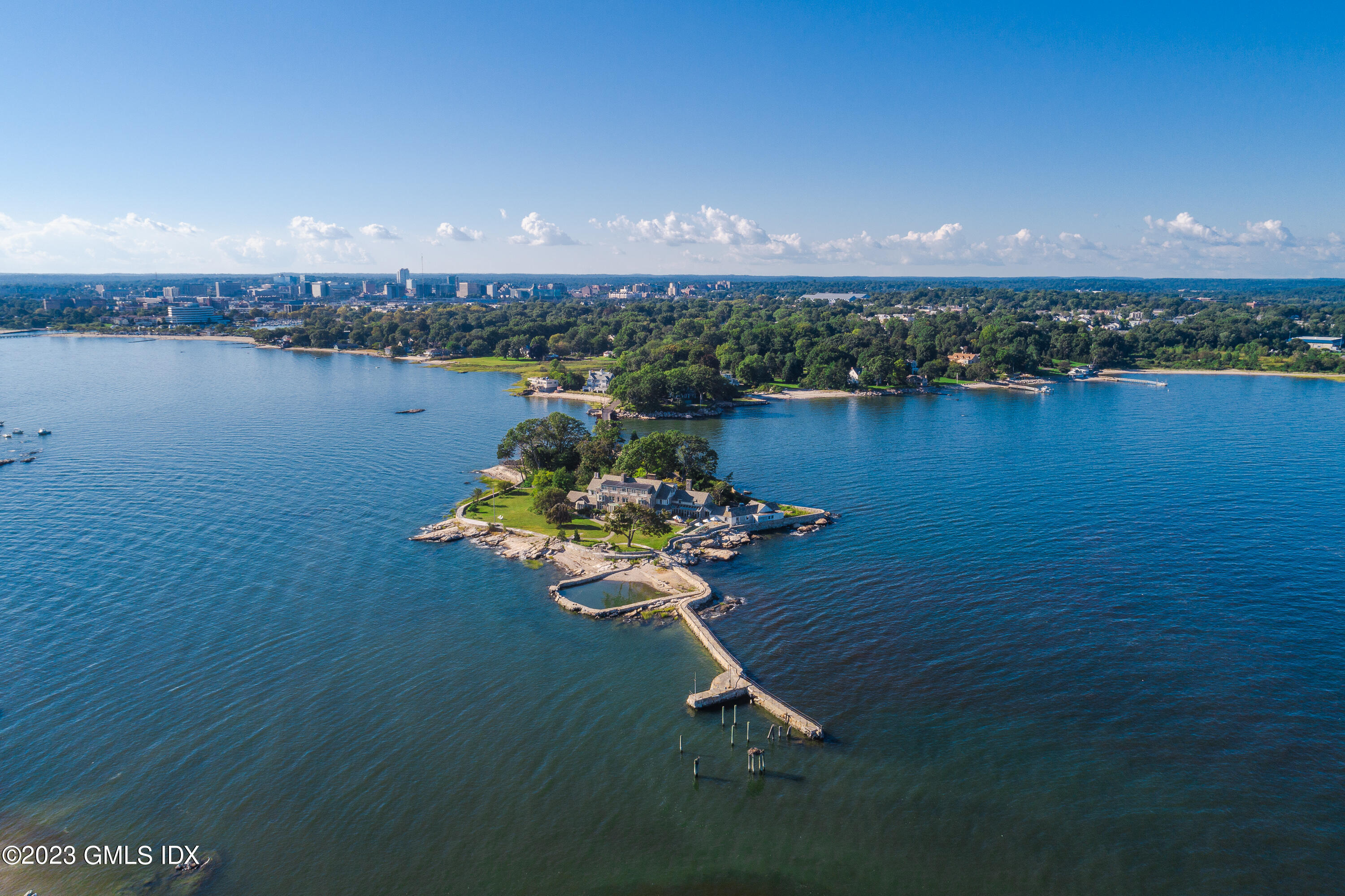 140 Wallacks Drive Stamford, CT 06902 - Photo 1 of 26 a view of a lake with a mountain in the background