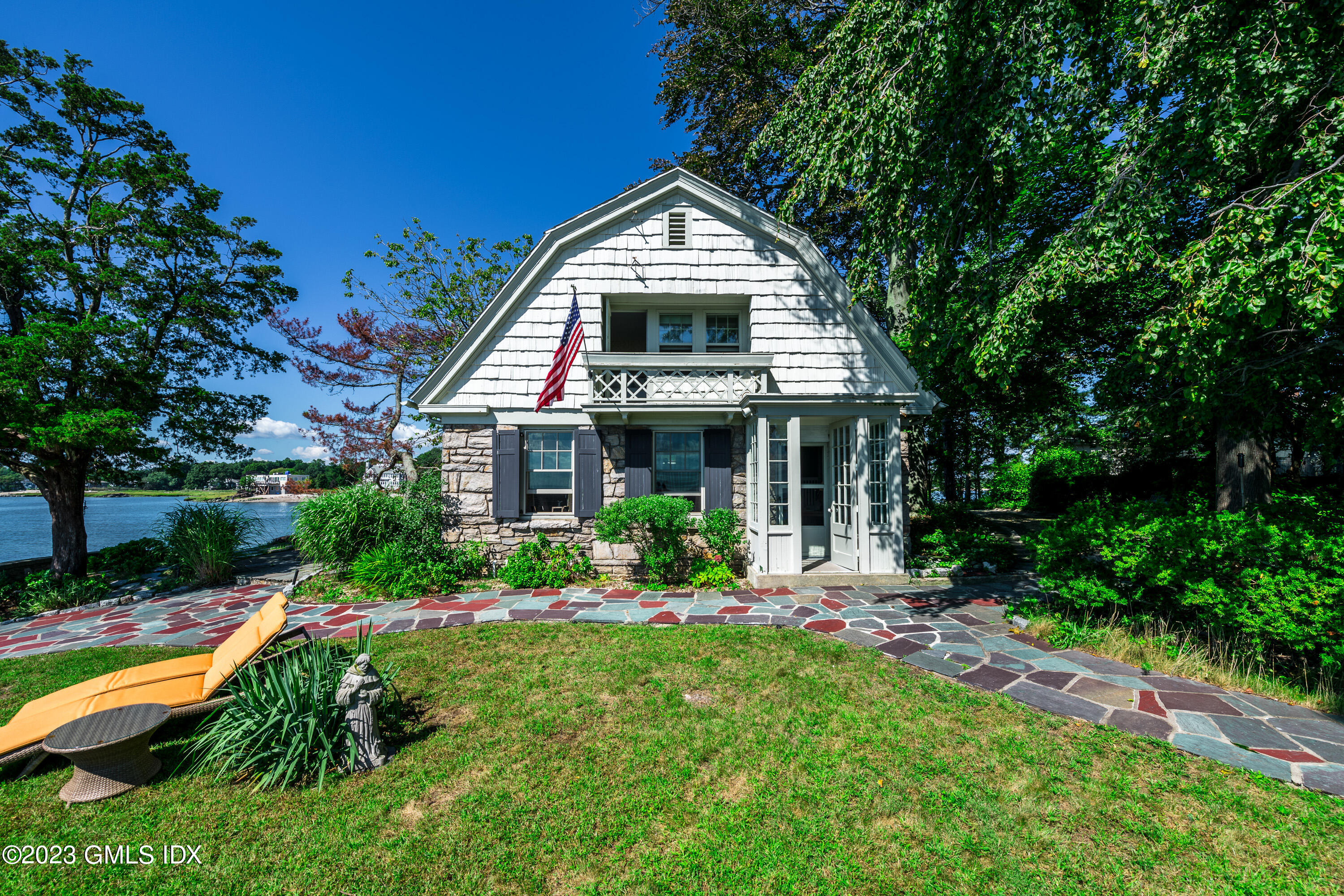 140 Wallacks Drive Stamford, CT 06902 - Photo 20 of 26 a front view of a house with porch and garden