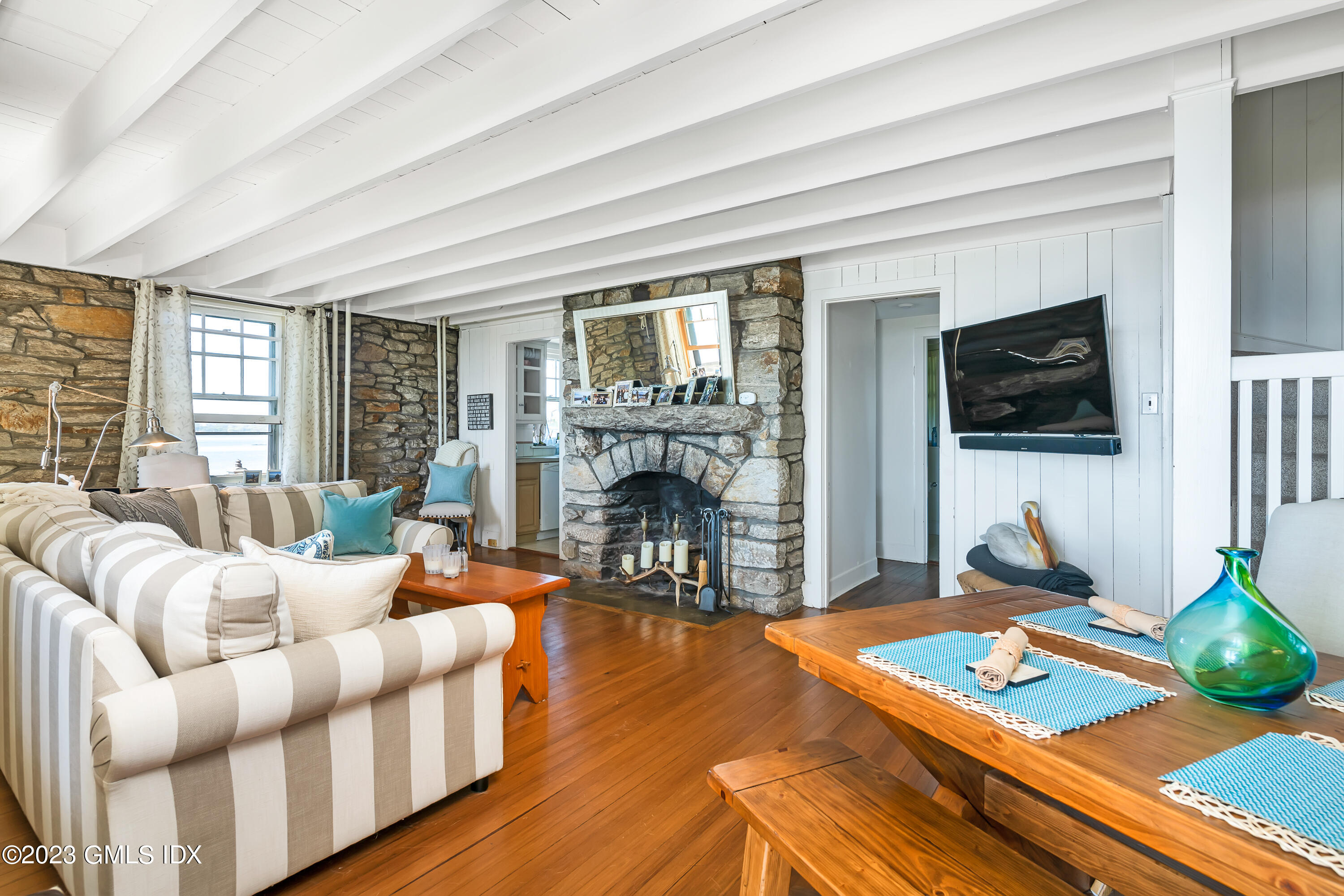 140 Wallacks Drive Stamford, CT 06902 - Photo 21 of 26 a living room with furniture a flat screen tv and a fireplace