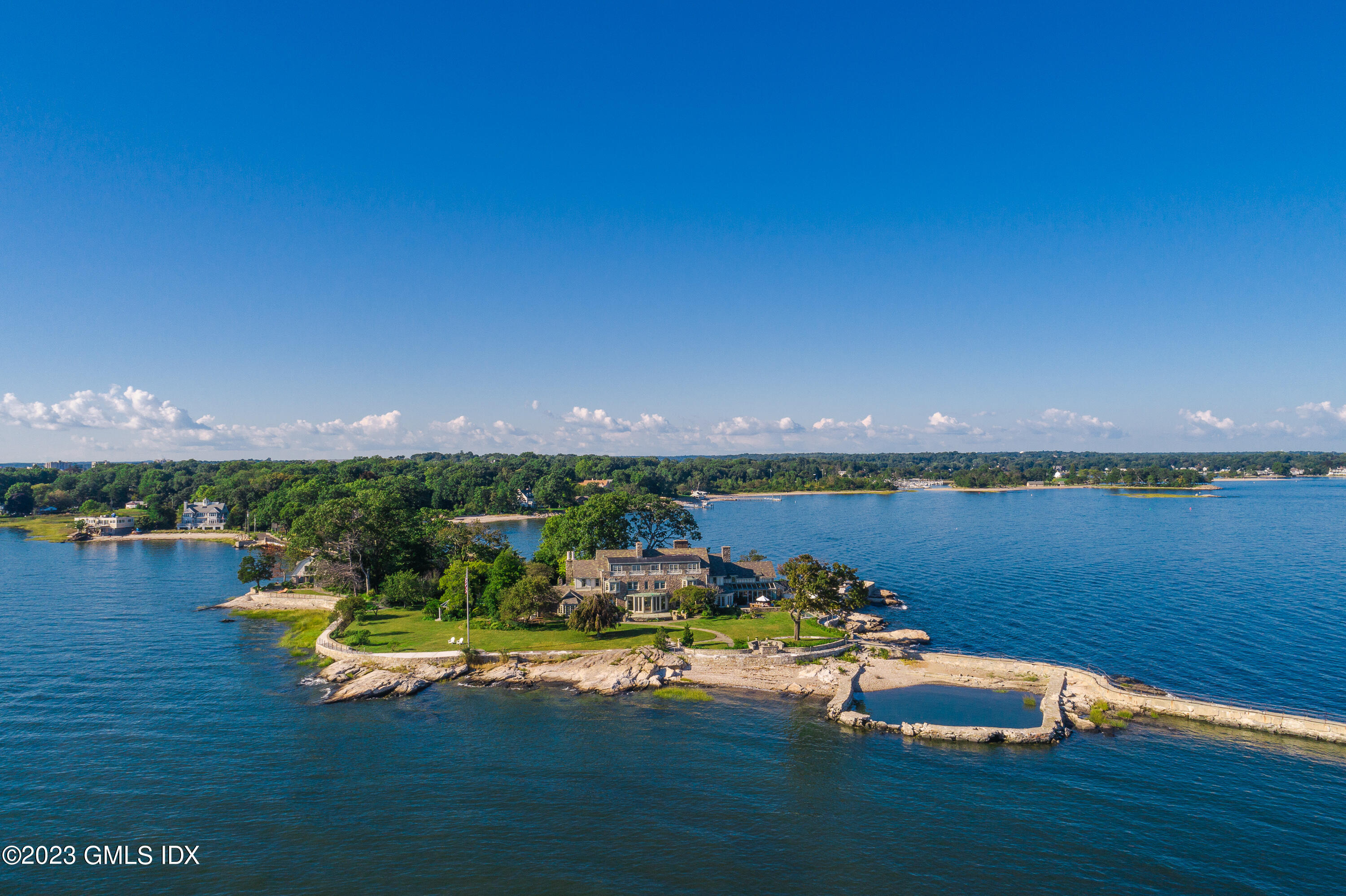 140 Wallacks Drive Stamford, CT 06902 - Photo 24 of 26 a view of a lake with lawn chairs