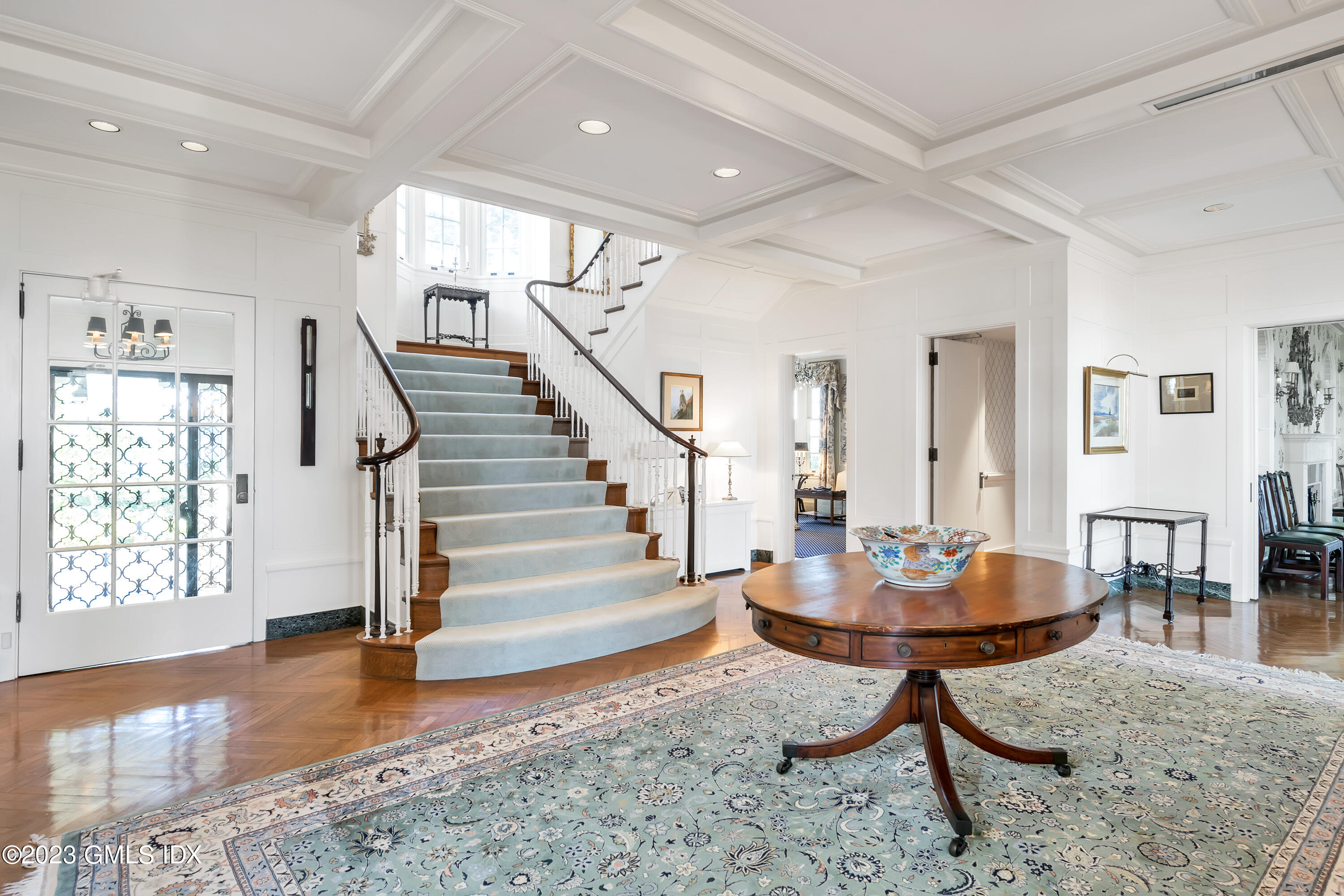 140 Wallacks Drive Stamford, CT 06902 - Photo 4 of 26 a living room with couches and dining table with wooden floor