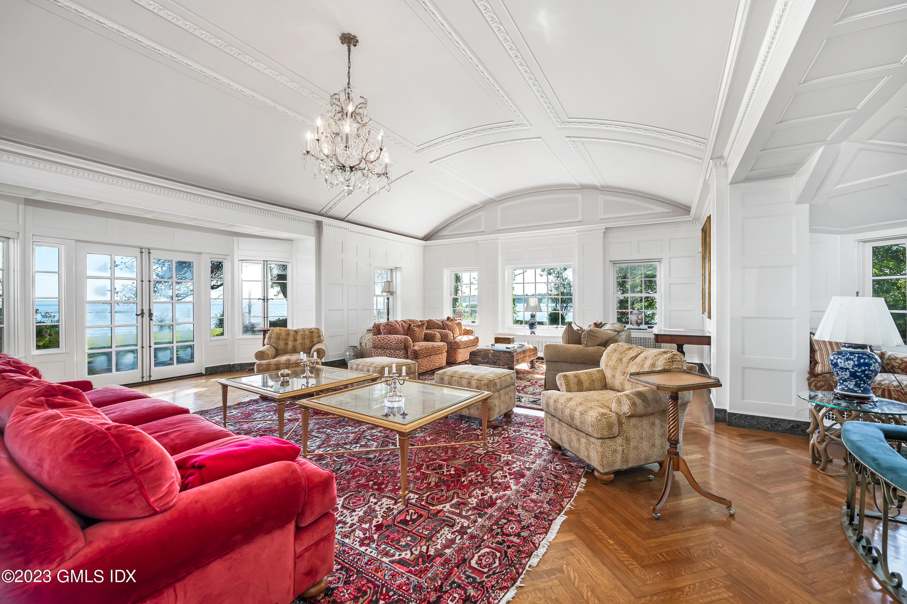 140 Wallacks Drive Stamford, CT 06902 - Photo 6 of 26 a living room with furniture flowers and a chandelier