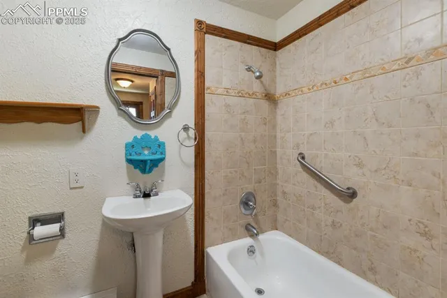 a bedroom with furniture and a large window