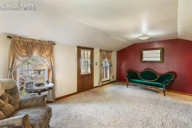 a living room with furniture and a area