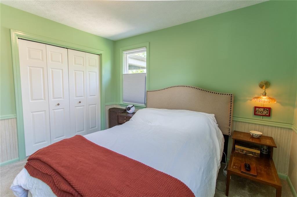 3211 Willett Road Pittsburgh, PA 15227 - Photo 16 of 27 a bedroom with a bed and a chair