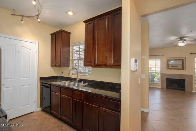 a kitchen with a sink and a refrigerator