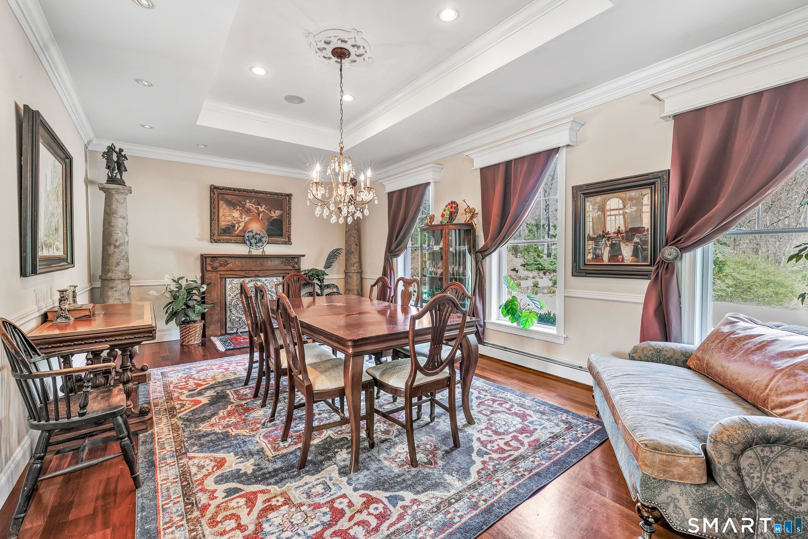 25 Starrs Ridge Road Redding, CT 06896 - Photo 6 of 38 Spacious formal dining room enhanced by a tray ceiling, crown molding, and large windows that fill the room with natural light.