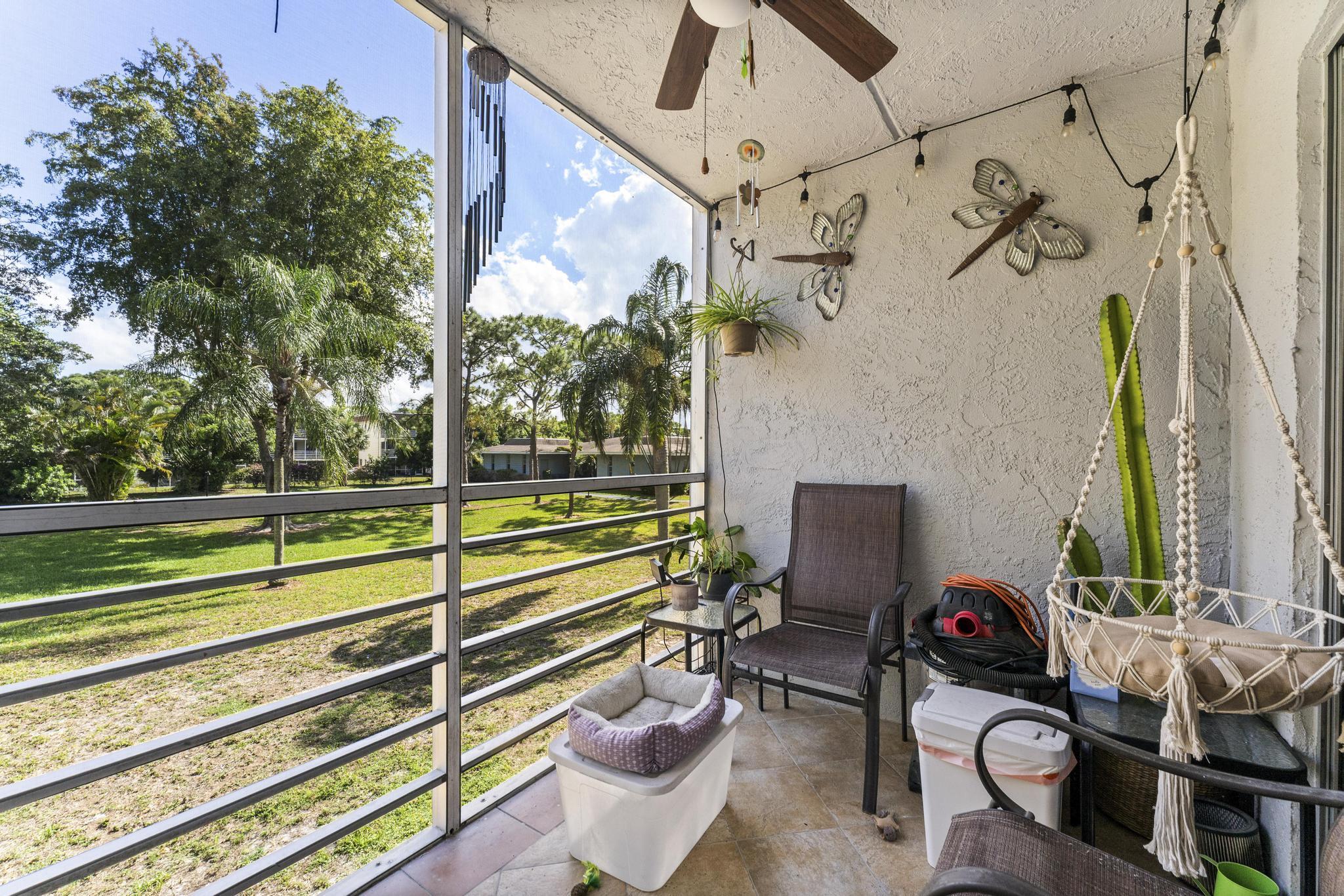 2000 Springdale Boulevard, Unit 209 Palm Springs, FL 33461 - Photo 17 of 26 a view of a chairs and table in the balcony