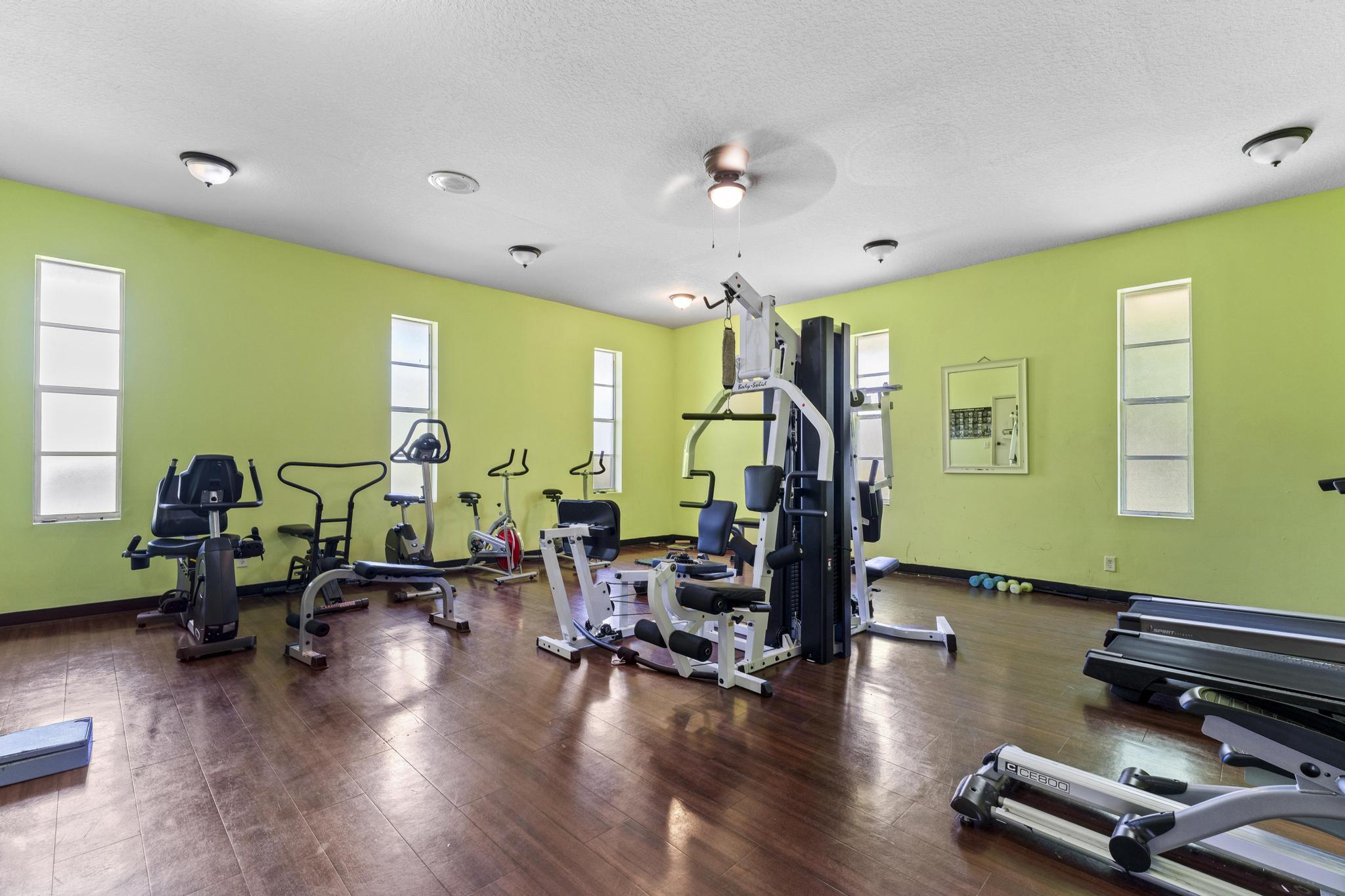 2000 Springdale Boulevard, Unit 209 Palm Springs, FL 33461 - Photo 18 of 26 a living room with furniture gym equipment and wooden floor