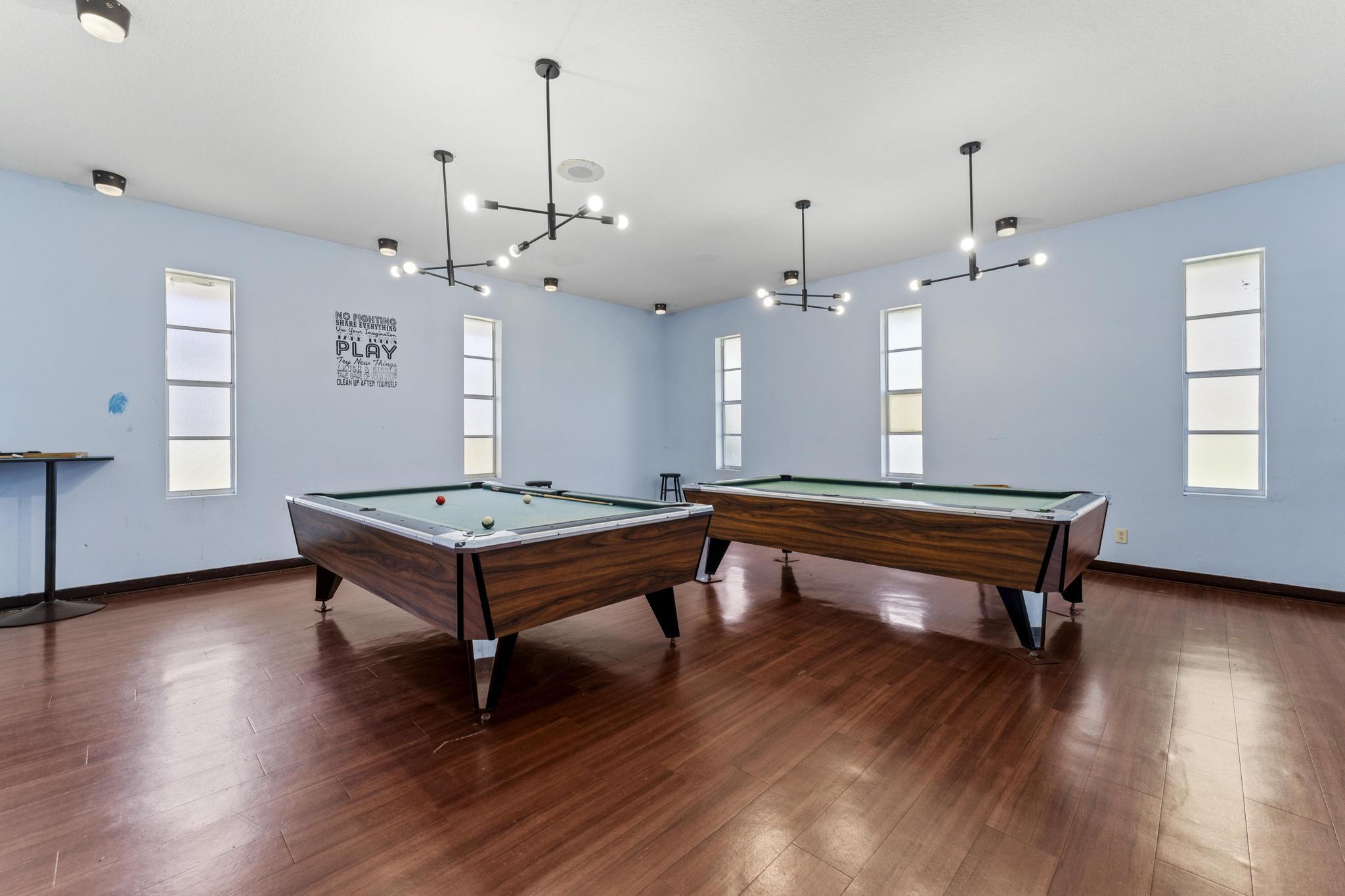 2000 Springdale Boulevard, Unit 209 Palm Springs, FL 33461 - Photo 19 of 26 a room with pool table windows and wooden floor