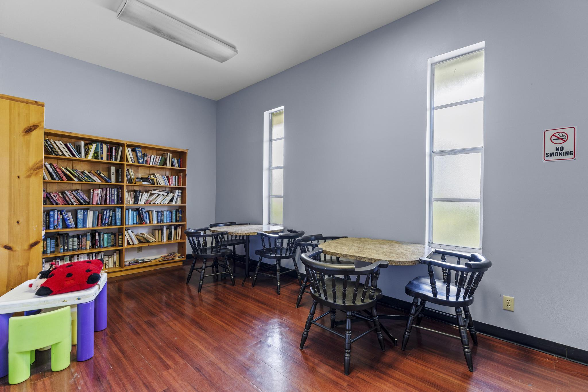 2000 Springdale Boulevard, Unit 209 Palm Springs, FL 33461 - Photo 20 of 26 a view of a workspace with furniture and wooden floor