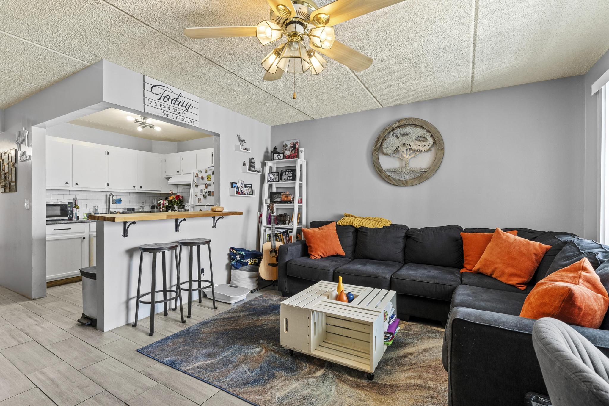 2000 Springdale Boulevard, Unit 209 Palm Springs, FL 33461 - Photo 3 of 26 a living room with furniture and kitchen view