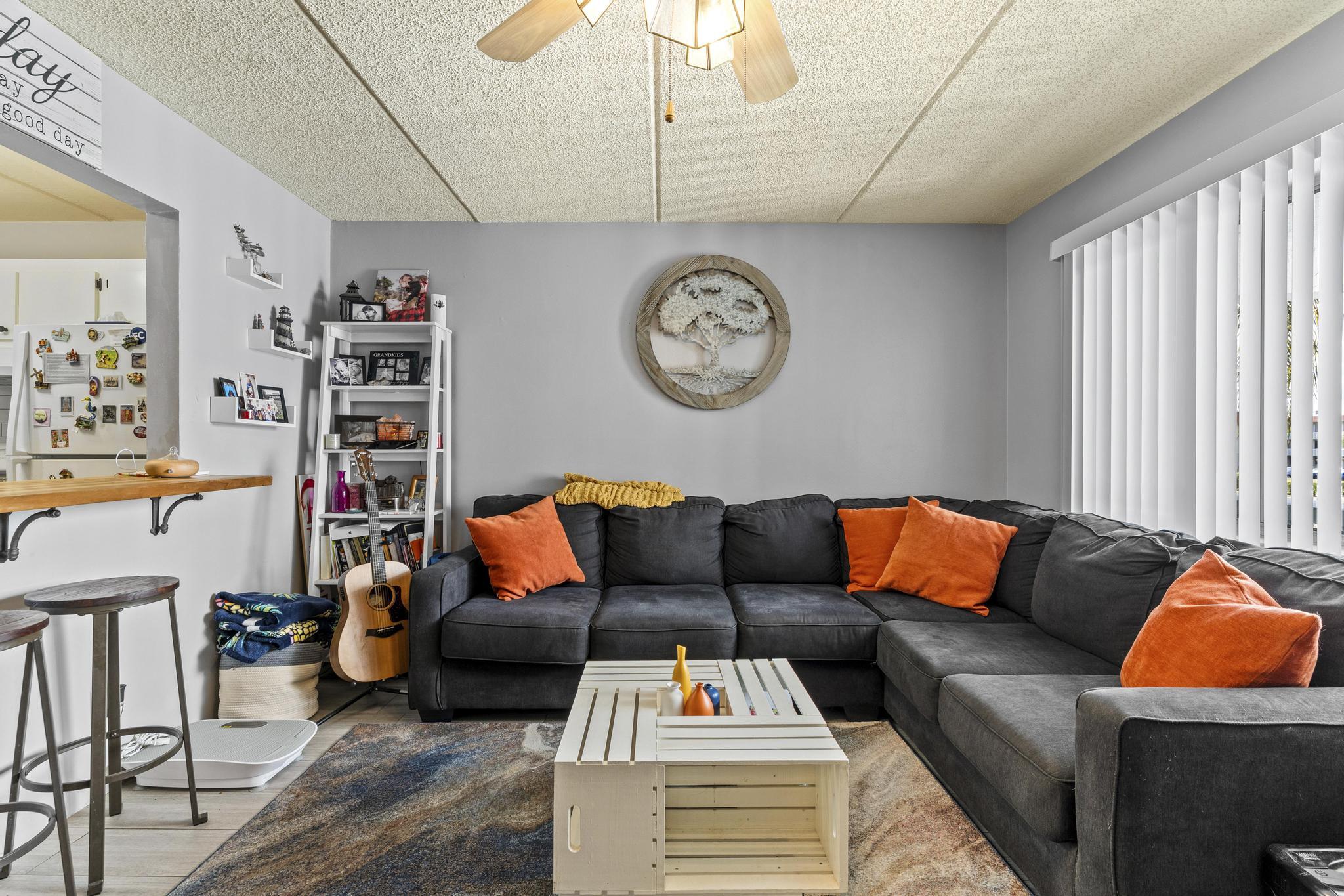 2000 Springdale Boulevard, Unit 209 Palm Springs, FL 33461 - Photo 4 of 26 a living room with furniture and a window