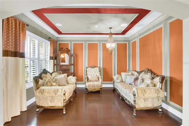 a spacious bedroom with furniture and a large window