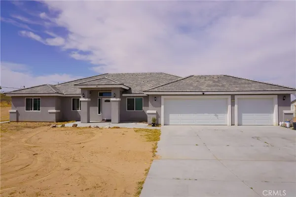 front view of a house with yard