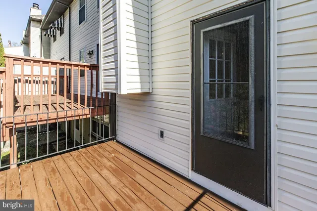 a view of a balcony with wooden floor